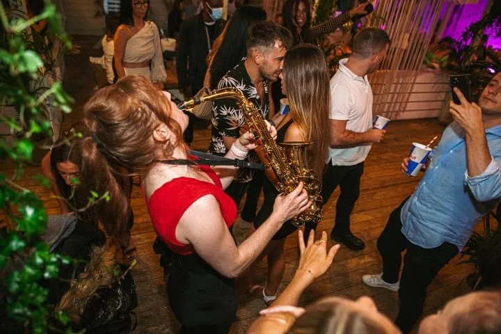 Sarah Saxophone performing at a London party