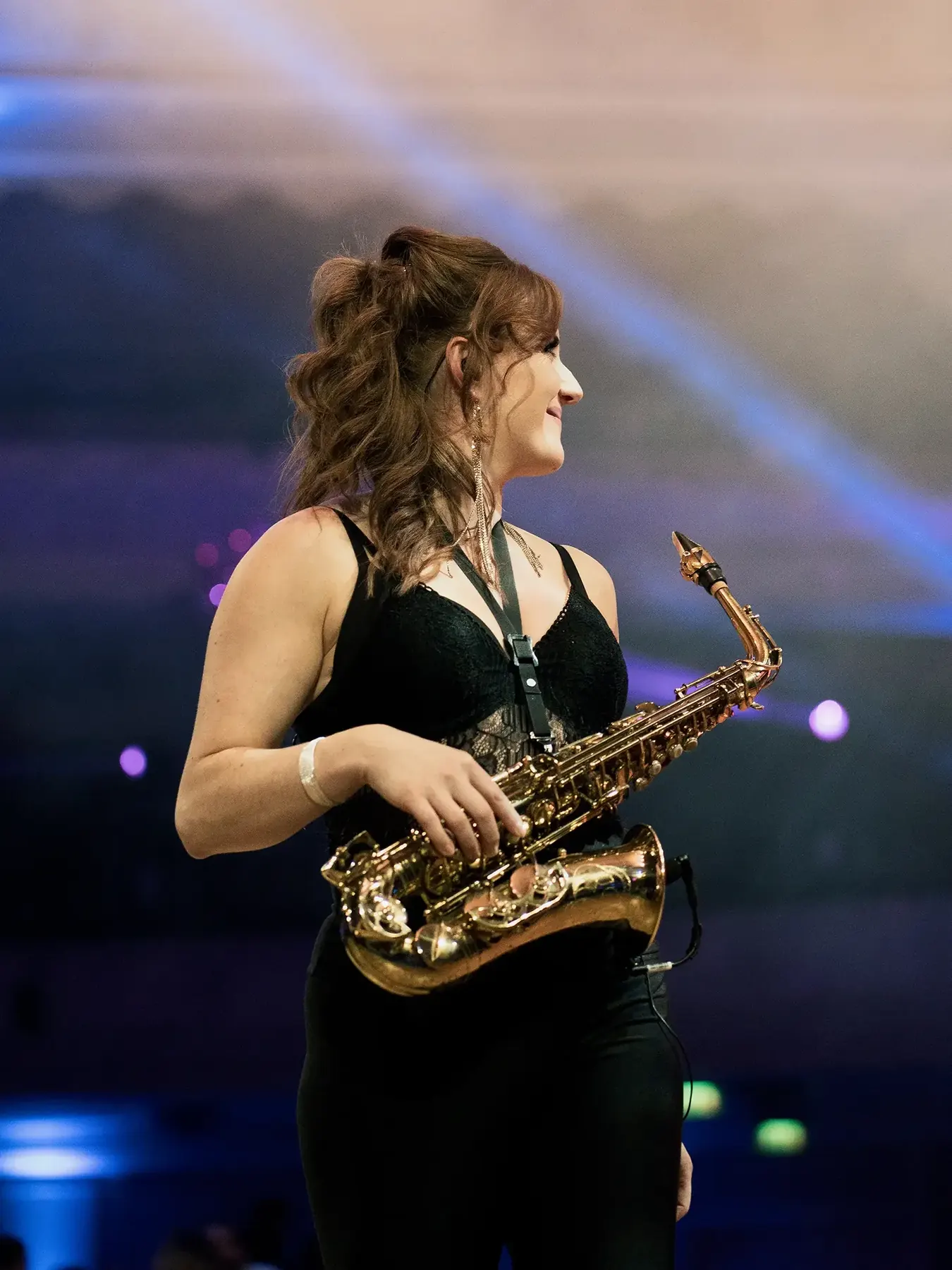 Sarah Saxophone performing on stage at a live event