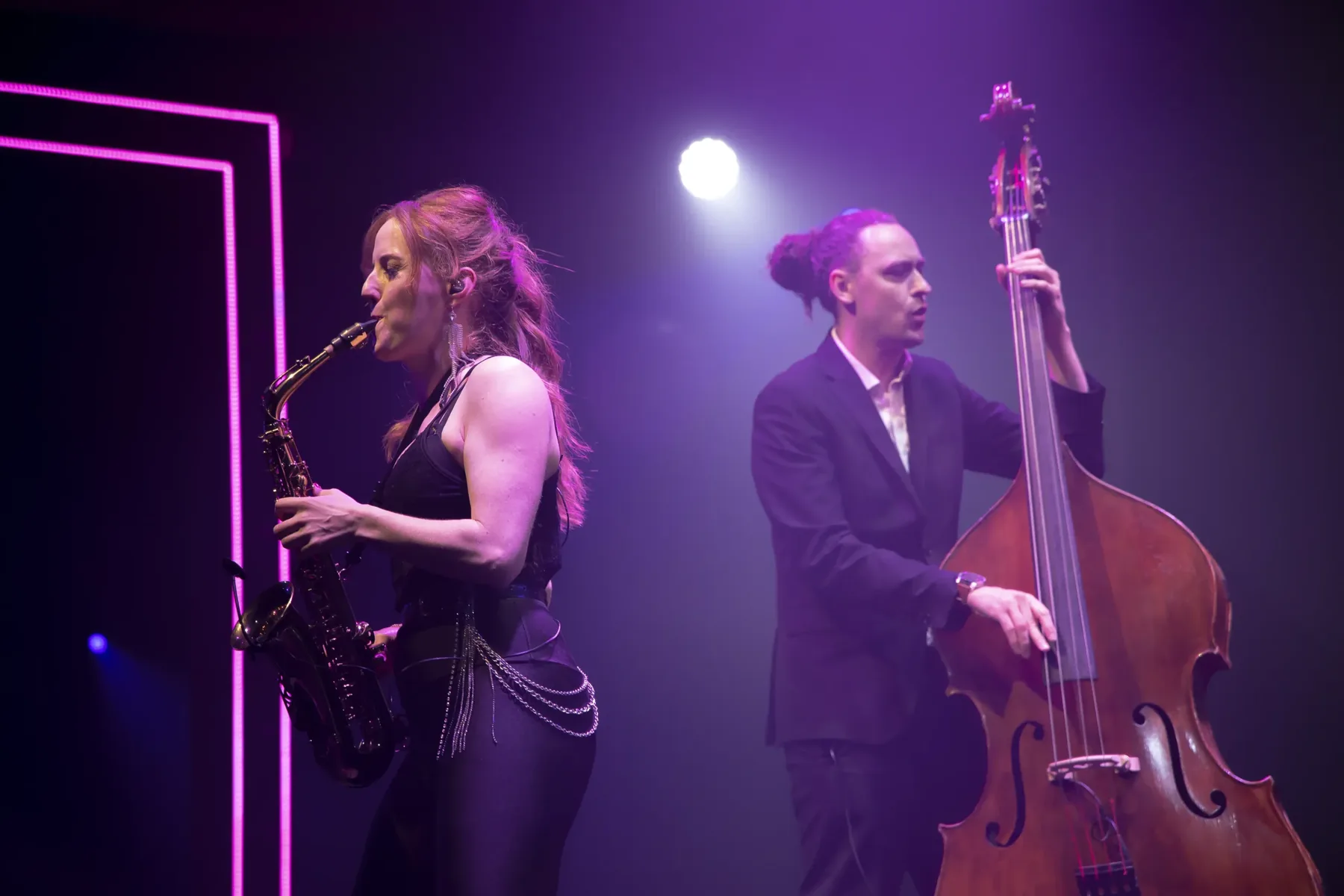 Sarah Saxophone performing with a double bass player at a club night