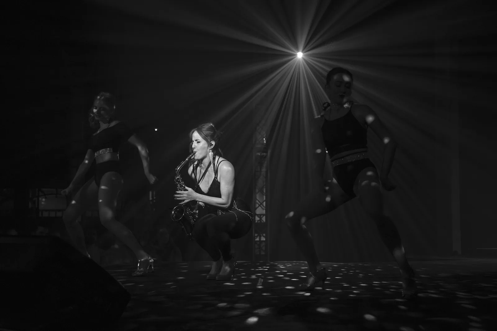 Sarah Saxophone performing live in black and white with her band