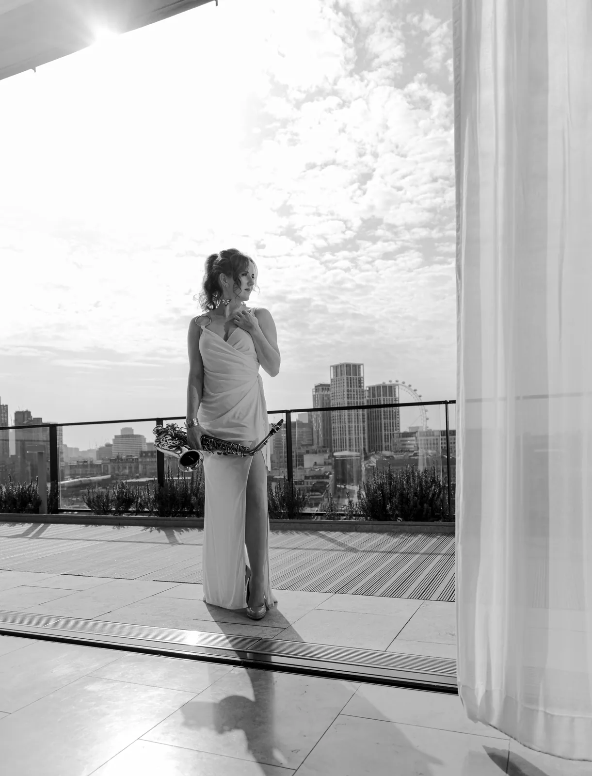 Sarah Saxophone portrait on a London rooftop at sunset