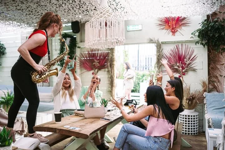 Sarah Saxophone performing for guests at a private party