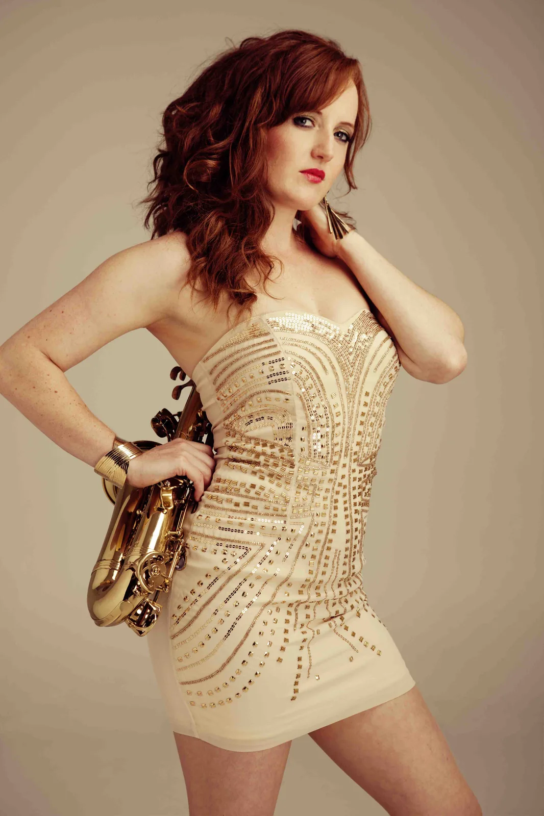 Saxophonist from Sahara portrait in gold dress