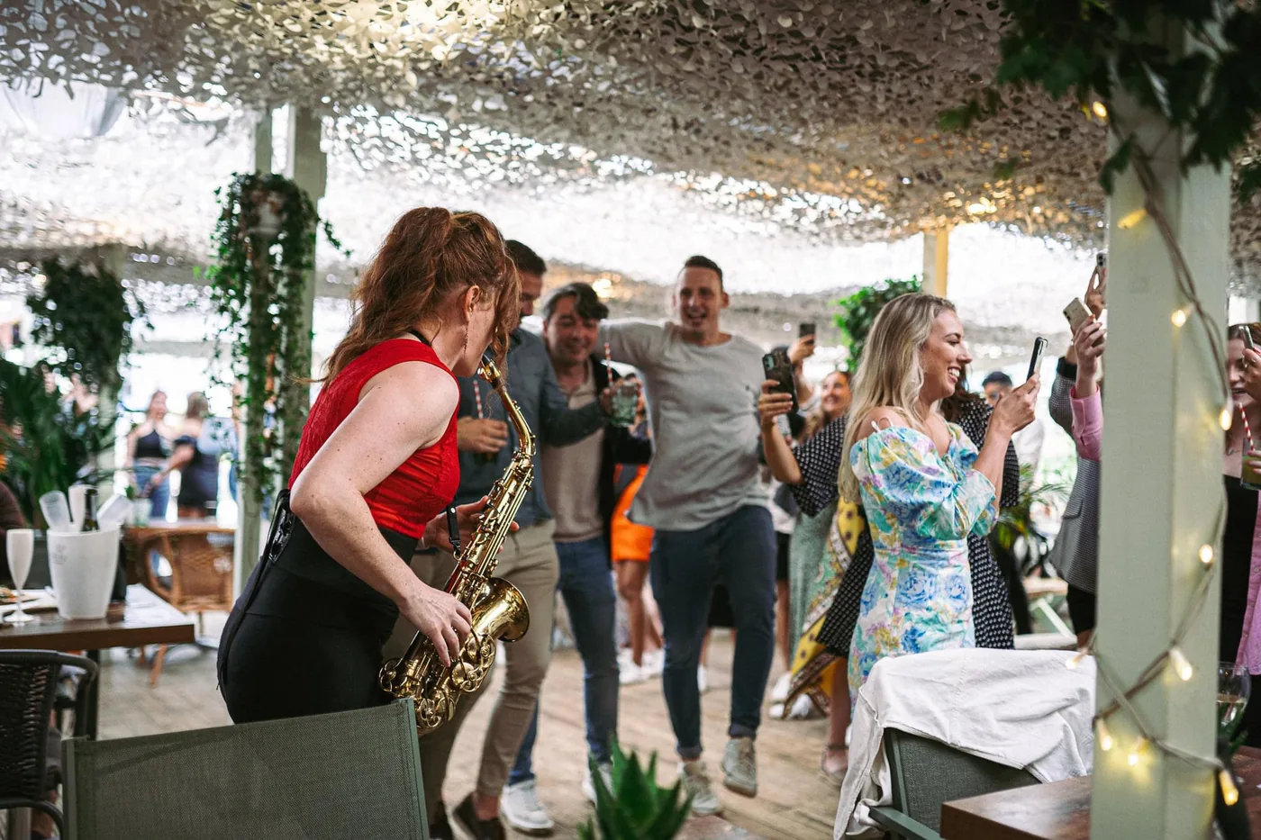 Sarah Saxophone roaming through guests at an event
